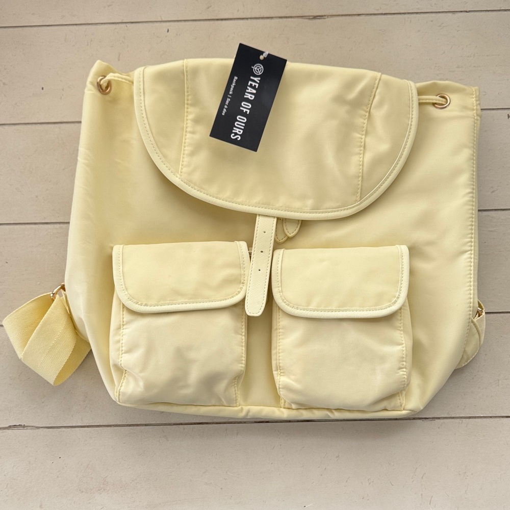 Year of Ours Pale Yellow Nylon Drawstring Backpack with Front Pockets